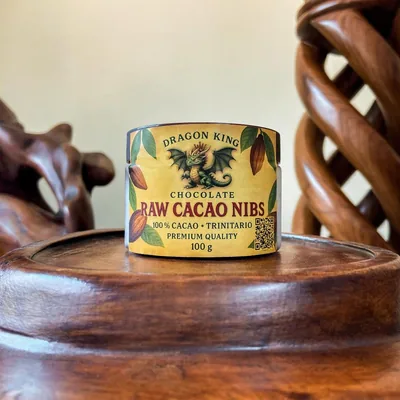 A small jar of Dragon King Chocolate raw cacao nibs, 100% Trinitario